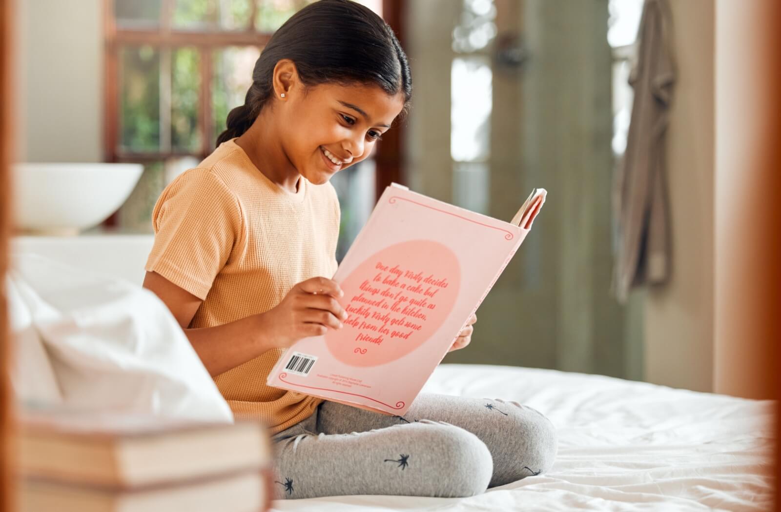 A young girl reading a large print low vision accessible book at home.